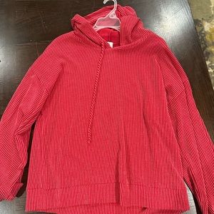 Bright red, ribbed, thin hoodie. Very soft. Size medium